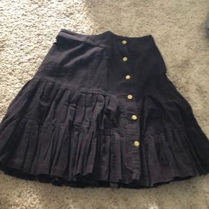 Brown corduroy skirt with pleats and buttons
